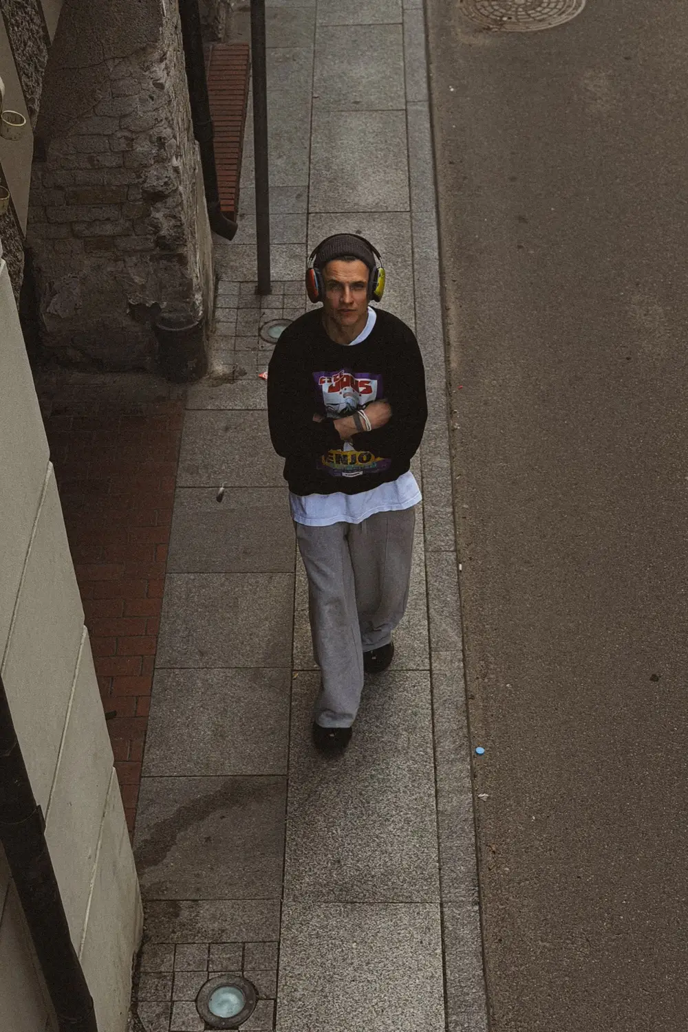 A second frame of the same walk, the figure mid-stride.
